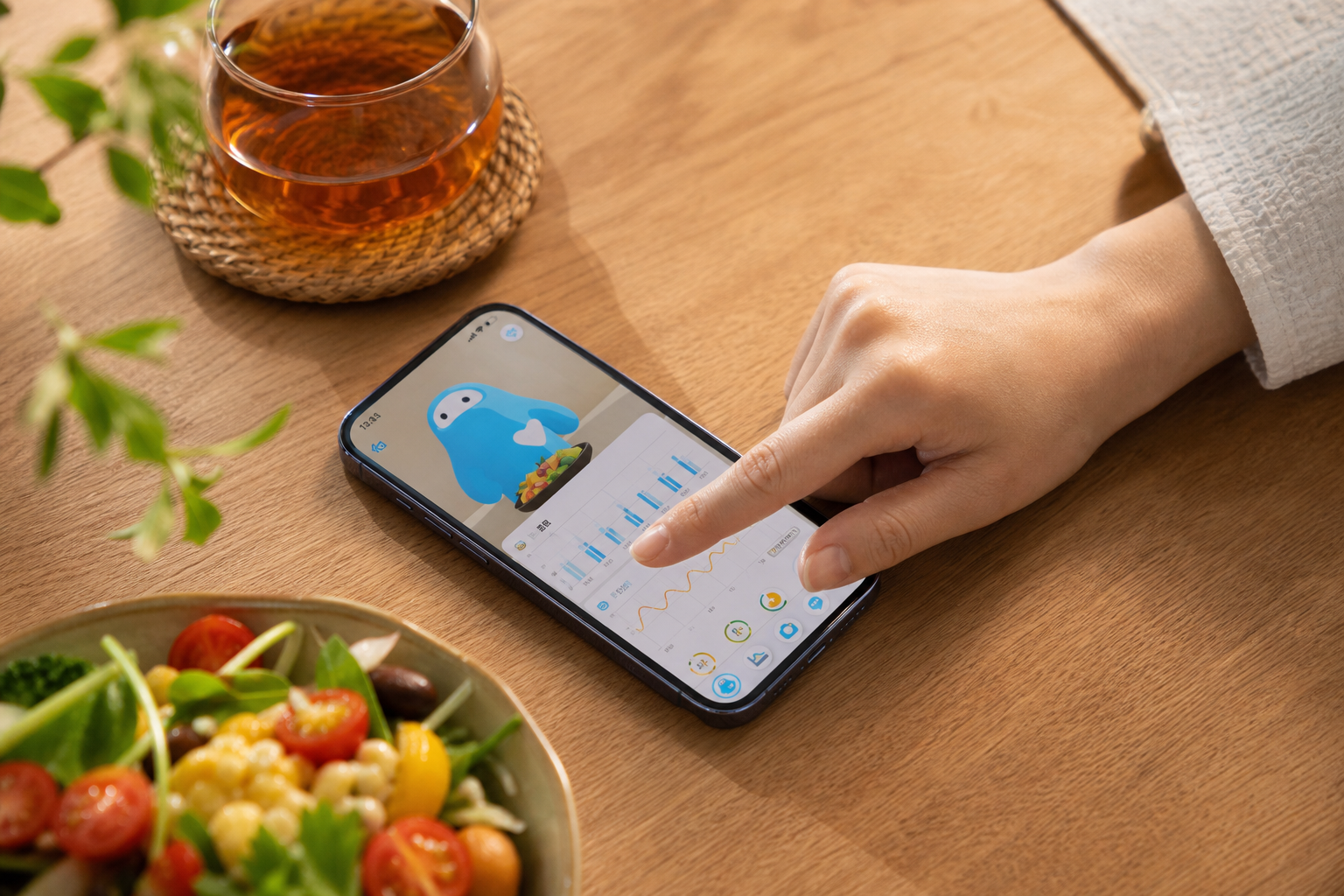 スマートフォンに表示される健康トレンドグラフとAI食事解析画面