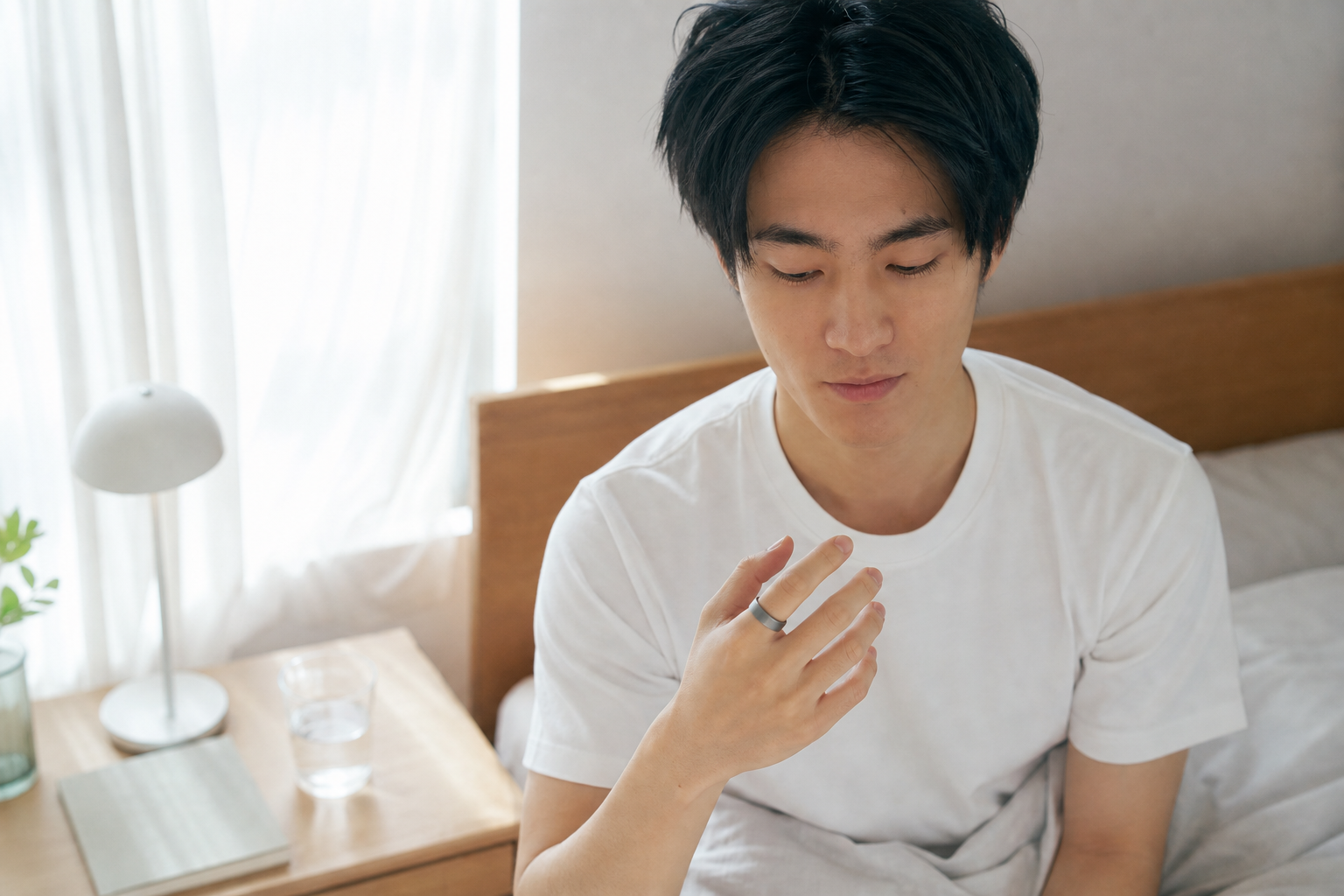 朝目覚めて回復スコアを確認する人